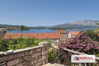 Three traditional stone houses and building land in Lumbarda with panoramic views
